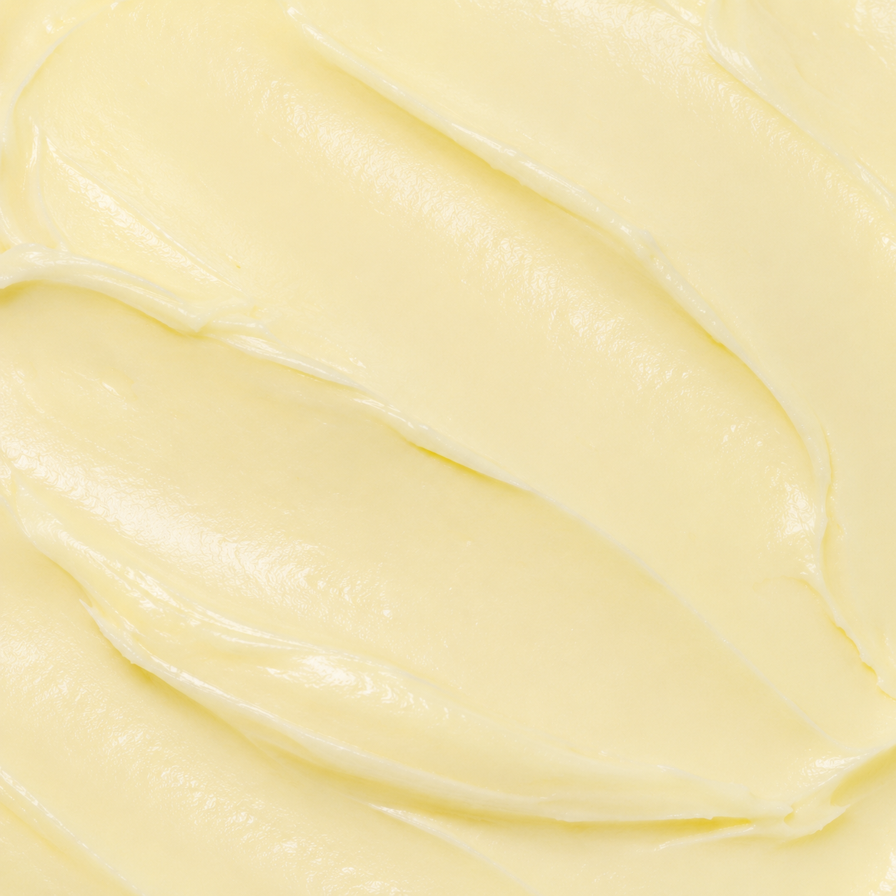 Close-up texture of Rivahna Cold Paraffin Mask, a rich creamy moisturizing treatment designed to hydrate, soften, and repair dry cracked skin on hands, feet, and body.