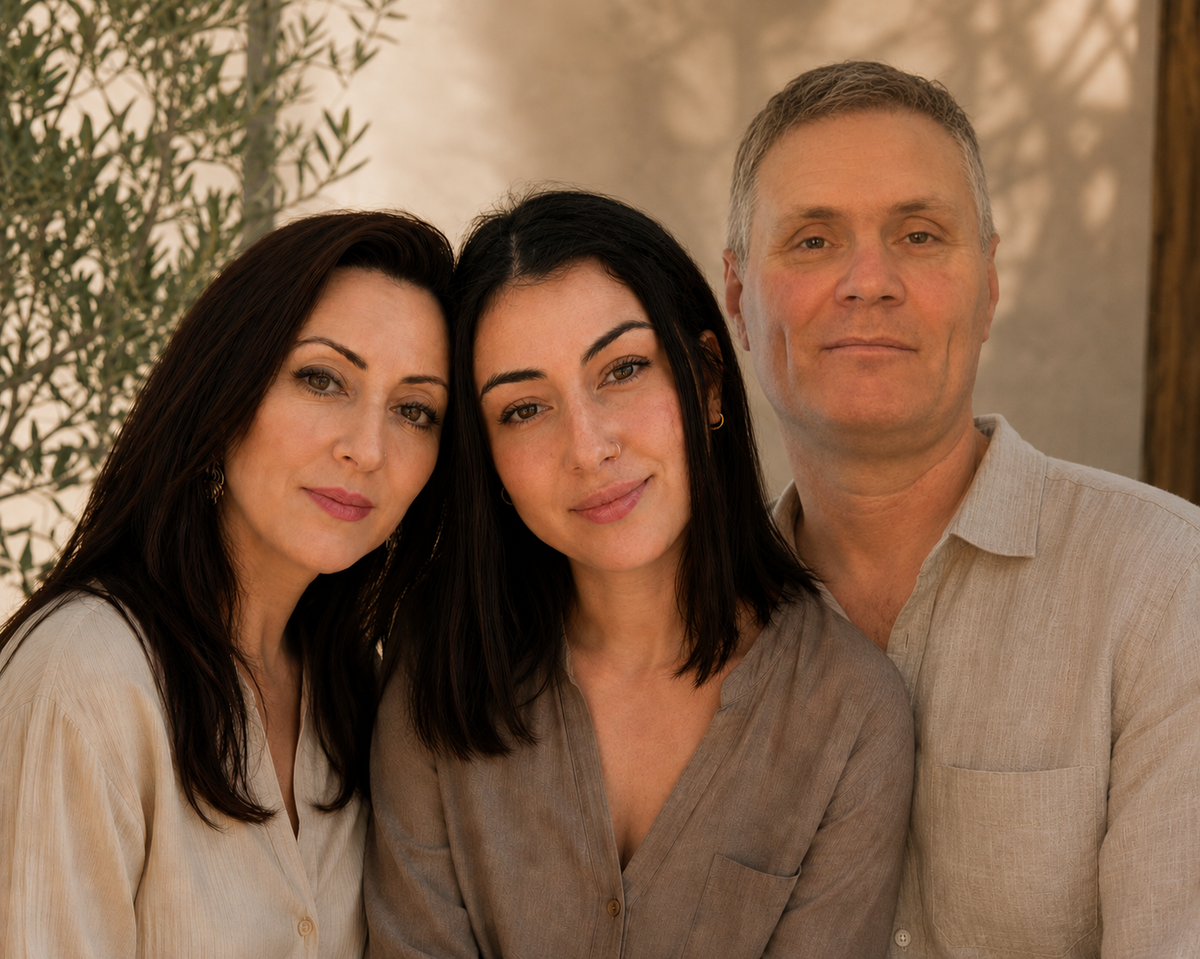 Founders of Rivahna posing together in soft earthy tones, representing a family-owned Canadian spa and self-care brand focused on handmade luxury skincare and wellness products.